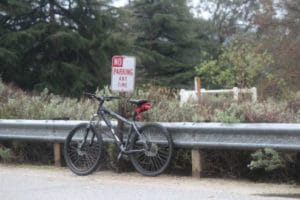 bike near a no parking sign | Queensland parking rules | Speed Humps Australia